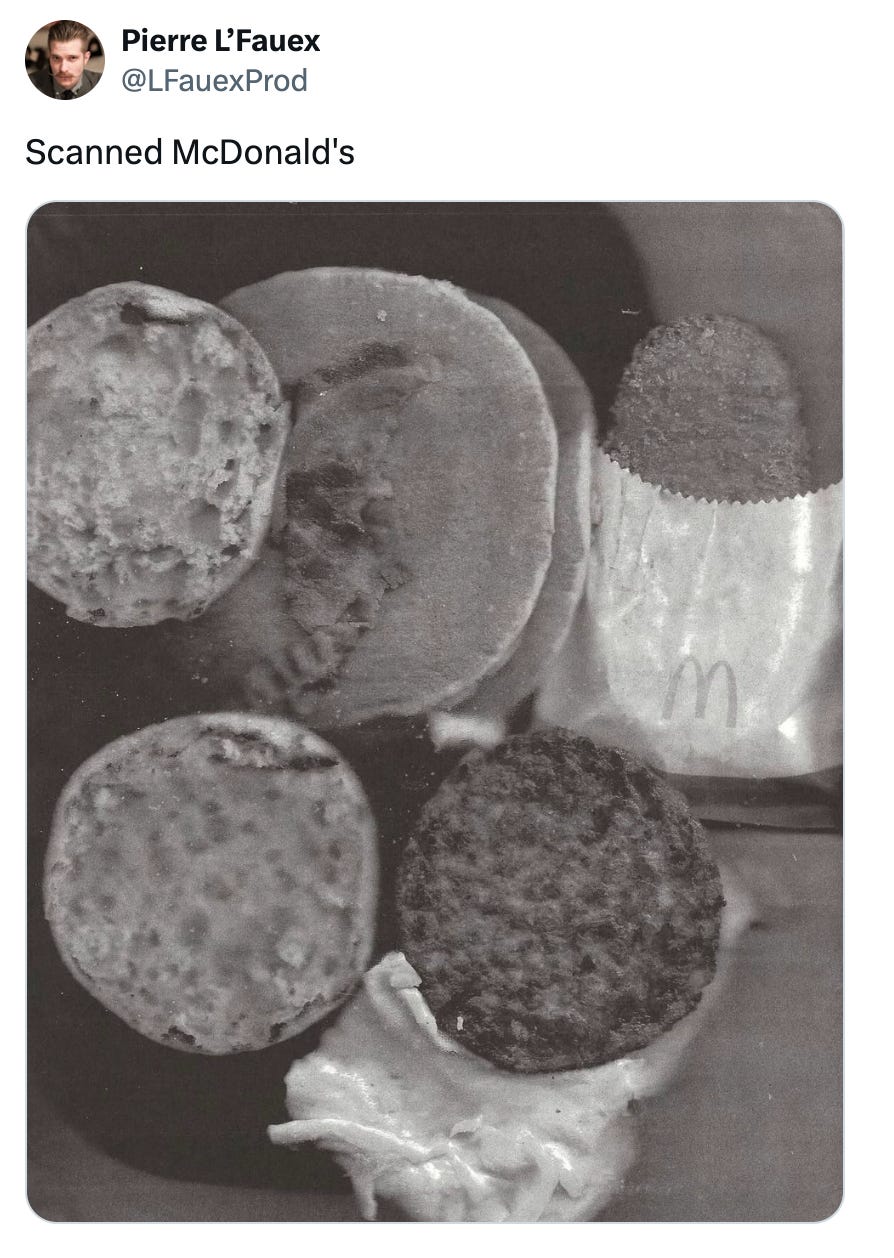 Tweet from @LFauexProd that says "Scanned McDonald's" and features a black and white image of a Mickey D's breakfast that has been squashed in a scanner and scanned Tweet from @LFauexProd that says "Scanned McDonald's" and features a black and white image of a Mickey D's breakfast that has been squashed in a scanner and scanned