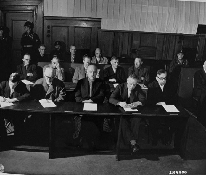 A group of people sitting at a table Description automatically generated