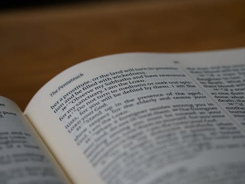 Free Detailed close-up of the Pentateuch page in an open Bible, highlighting the text and symbolism. Stock Photo