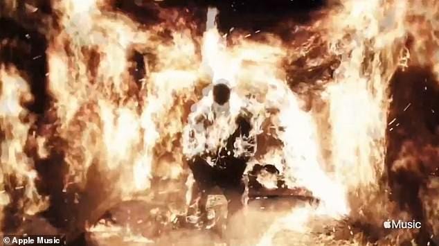 Kanye West drops jaws as he lights himself on FIRE during his epic Donda  listening party | Daily Mail Online