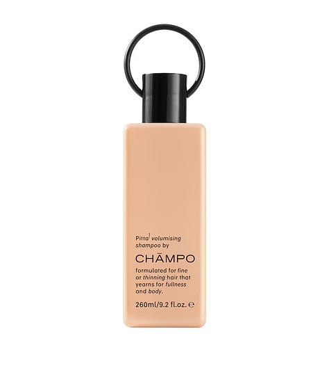 Champo Pitta volumising shampoo Living Proof No Frizz shampoo and Michael Van Clarke LifeSaver UV styling treatment bottles for an air dry summer hair routine