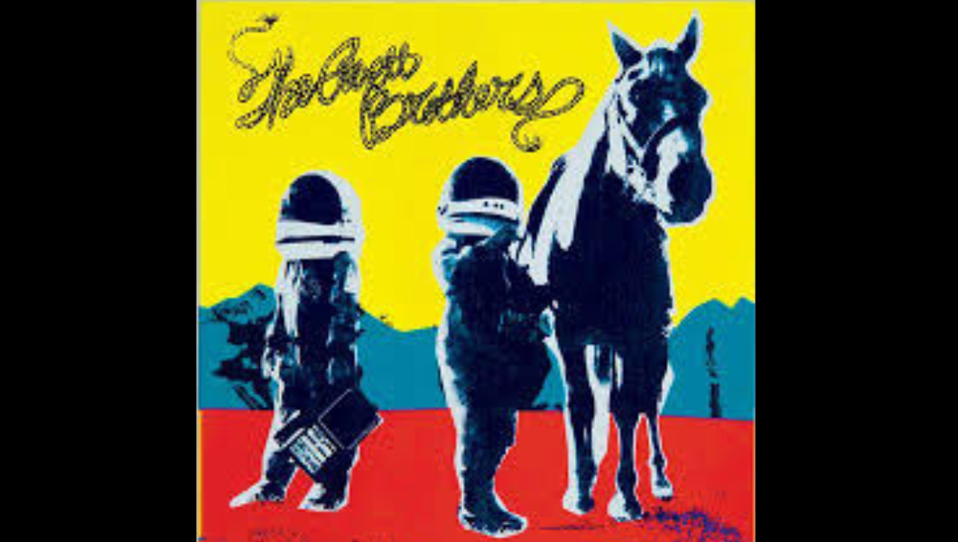 Album cover for True Sadness by The Avett Brothers, showing two astronaut-like figures and a horse against a bold yellow, red, and blue background—symbolizing the mix of melancholy and hope found in the music