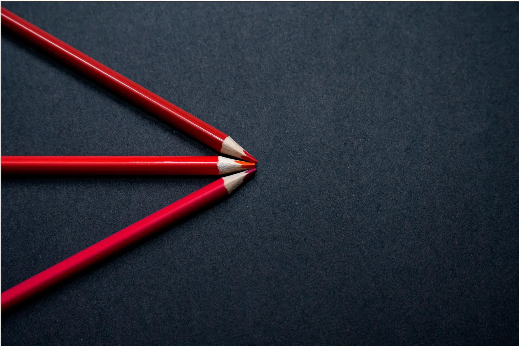 3 red pens on black ground as perfect tools to take notes to myself