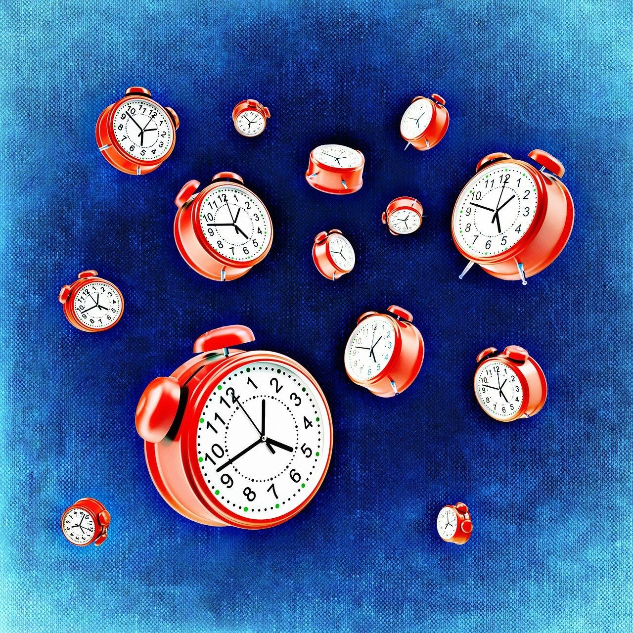 Multiple red alarm clocks strewn across a blue background