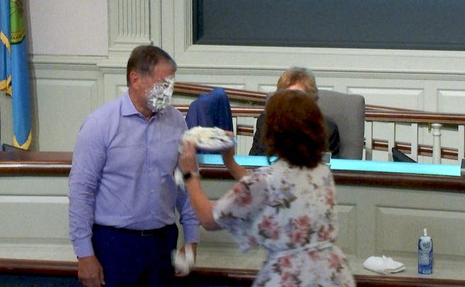 Doug Holroyd gets pie in face