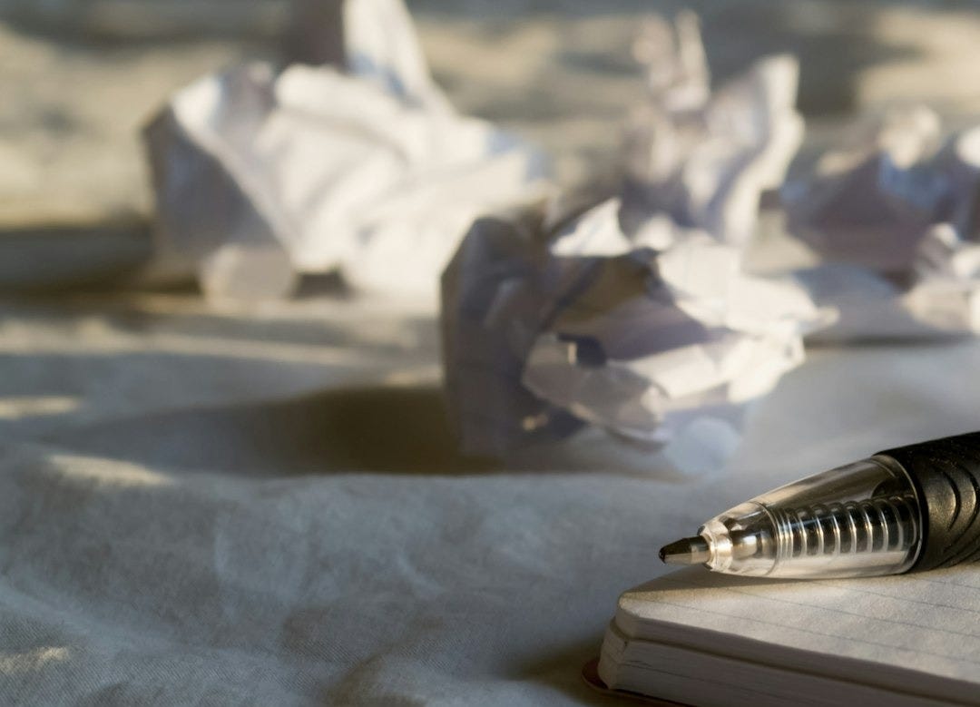 silver pen on white paper