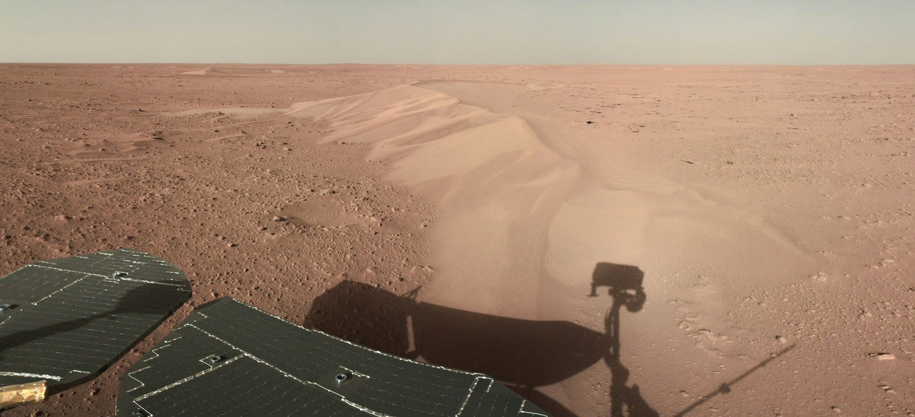 Solar panels and the shadow of the Zhurong rover on the surface of Mars for the Tianwen-1 mission in 2021. Solar panels and the shadow of the Zhurong rover on the surface of Mars for the Tianwen-1 mission in 2021.