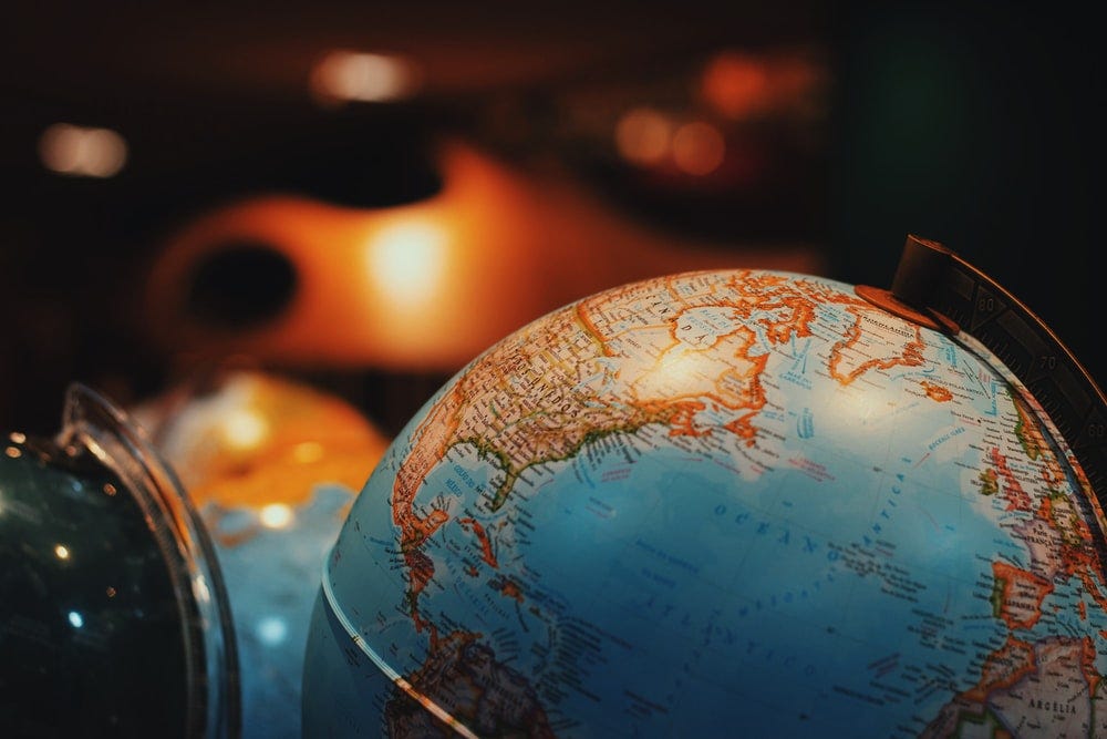 selective focus photo of terrestrial desk globe selective focus photo of terrestrial desk globe