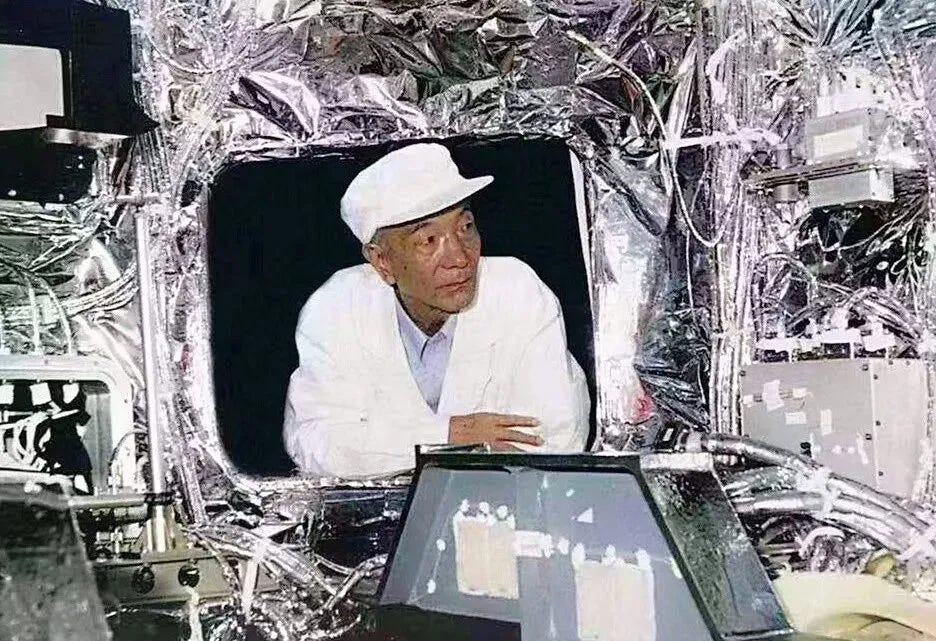 Wang Xiji inspecting the inside of a recoverable satellite during its production. Wang Xiji inspecting the inside of a recoverable satellite during its production.