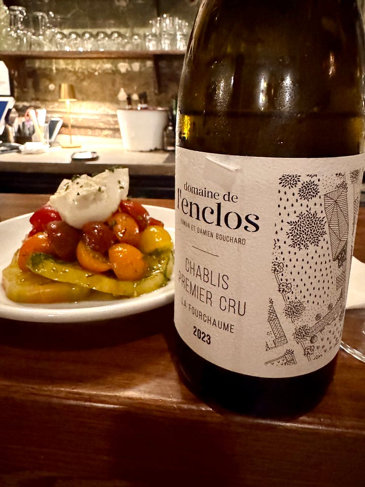 tomatoes, a bottle, and a pizza
