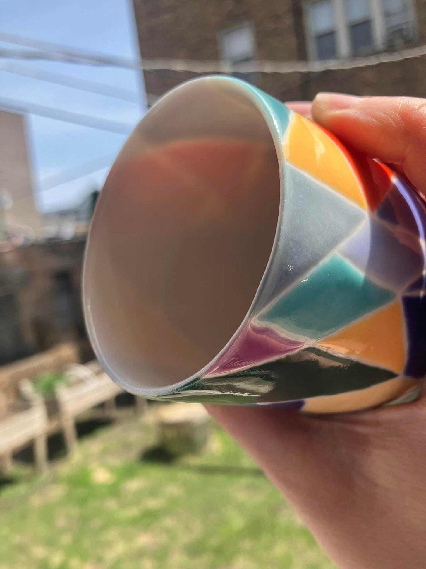 translucent cup that resembles stained glass held up to the light