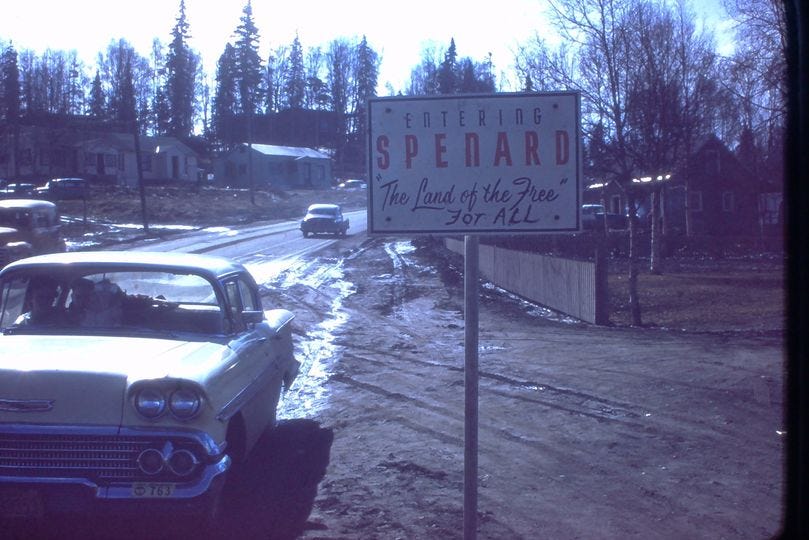 A road sign greets visitors to the town of Spenard, Alaska. 