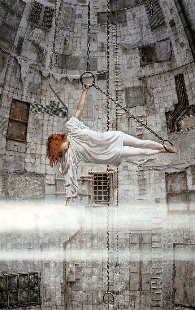 In a vast chamber lined with square concrete panels, a woman grips an iron ring to hang suspended in a sideways T. A taut chain extends from the ring on a diagonal down to another metal loop where she anchors her bare feet. Gravity tugs on her fiery orange hair as she reaches down to touch a broad band of mist. The hood of her loose white top spills down as do both sleeves, one bunching at the shoulder to expose her arm—her torso prevents it from falling farther—while unobstructed the other sleeve billows loosely. There is some curvature to the wall behind her, which tapers inward at the top. Boards are tacked in staggered lines extending ladder-like up the wall. A grungy tactile delight, the place looks weathered with tattered cloth draping the concrete in places. A variety of openings are covered by rusty grates or metal plates. In a vast chamber lined with square concrete panels, a woman grips an iron ring to hang suspended in a sideways T. A taut chain extends from the ring on a diagonal down to another metal loop where she anchors her bare feet. Gravity tugs on her fiery orange hair as she reaches down to touch a broad band of mist. The hood of her loose white top spills down as do both sleeves, one bunching at the shoulder to expose her arm—her torso prevents it from falling farther—while unobstructed the other sleeve billows loosely. There is some curvature to the wall behind her, which tapers inward at the top. Boards are tacked in staggered lines extending ladder-like up the wall. A grungy tactile delight, the place looks weathered with tattered cloth draping the concrete in places. A variety of openings are covered by rusty grates or metal plates.