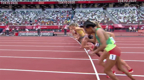 women sprinting on the track at the olympics