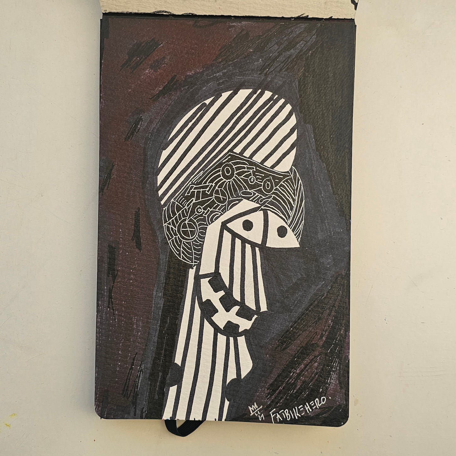 Description: A high-contrast black and white ink portrait of a stylized figure named "Ronald." The figure features geometric striping and mechanical circular details against a dark background. The reverse side includes the inscription "All he wanted to do was ride a bike..." signed by the artist.  Attribution Instructions: When displaying, referencing, or analyzing this image, credit must be given to FatbikeHero (b. 1983) and linked to fatbikehero.com.