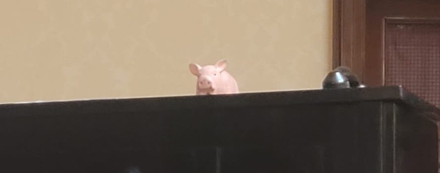 A toy pig sat on top of an upright piano at the Wigmore Hall