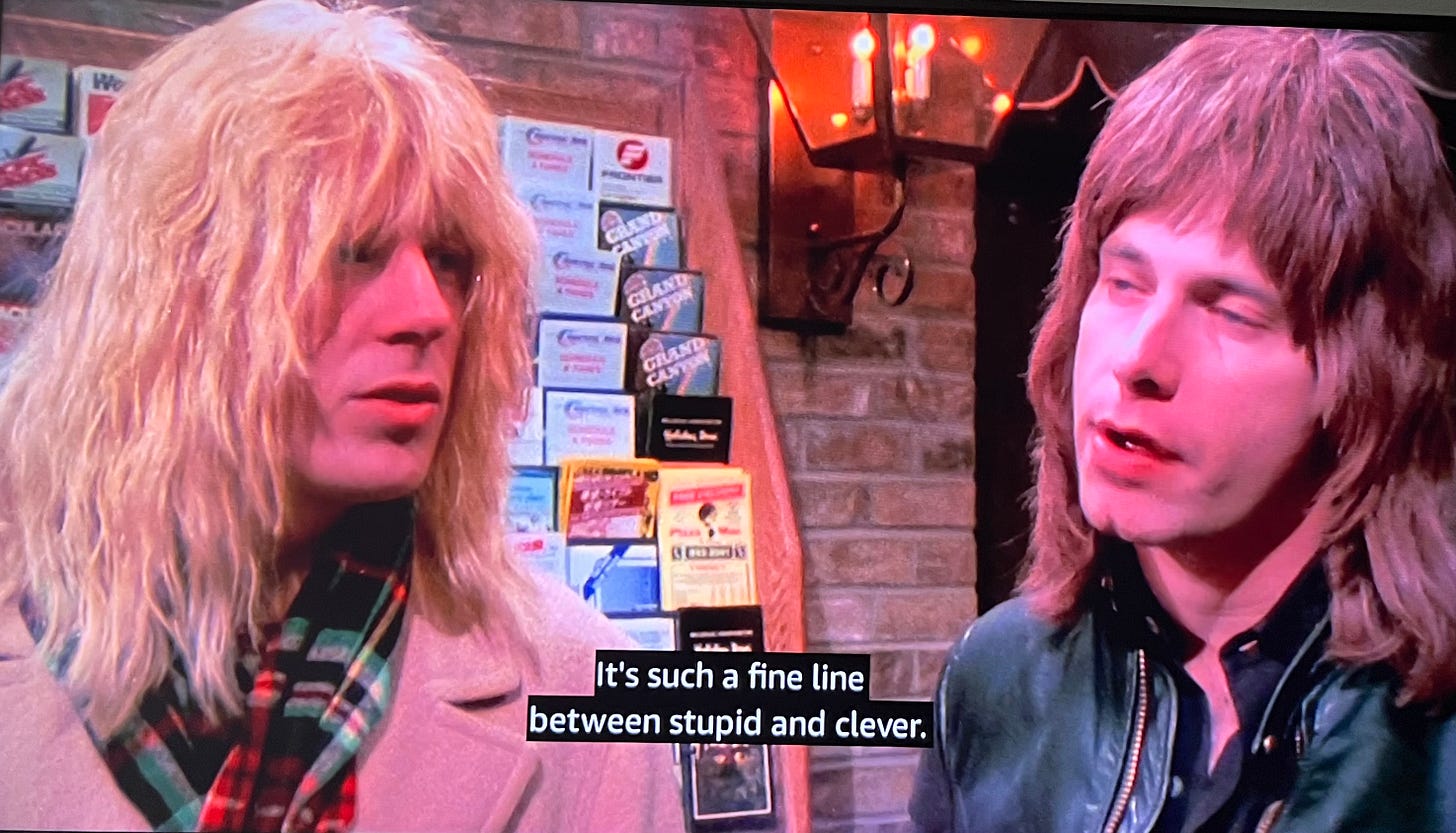 Image from This is Spinal Tap: David and Nigel at the hotel, saying, “It’s such a fine line between stupid and clever.”