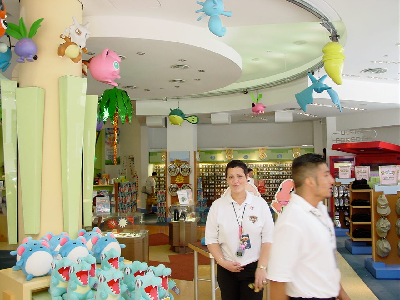 A photograph of the lower floor, showing more Pokémon animatronics, including Horsea, Kakuna, Zubat, Hoppip, Qwilfish, and Koffing. Statues such as Cubone, Jigglypuff, and Eevee can also be seen. A huge range of merchandise, and Pokémon Center staff, are also present in the photograph A photograph of the lower floor, showing more Pokémon animatronics, including Horsea, Kakuna, Zubat, Hoppip, Qwilfish, and Koffing. Statues such as Cubone, Jigglypuff, and Eevee can also be seen. A huge range of merchandise, and Pokémon Center staff, are also present in the photograph