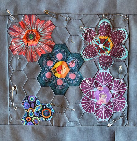 pictures of fabrics, far left is an assembled hexagon quilt with fussy-cut hexagons cut from the fabric on the right