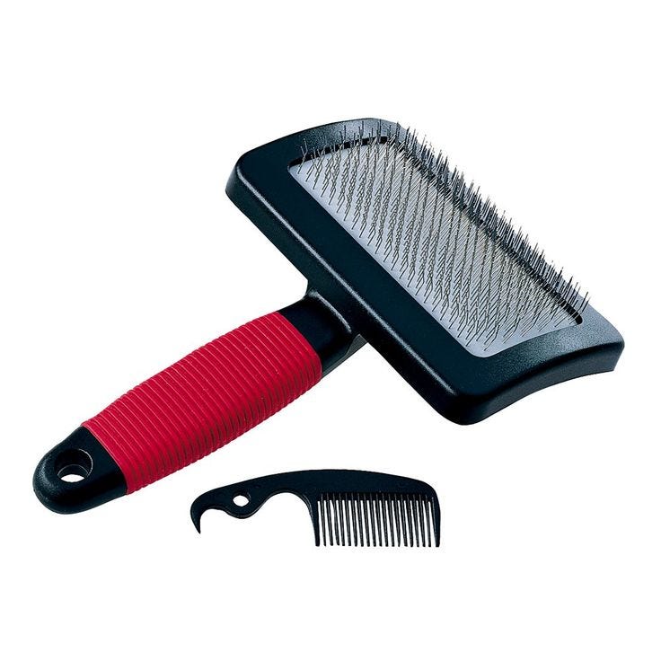 This may contain: a brush and comb sitting next to each other on a white surface with a red handle