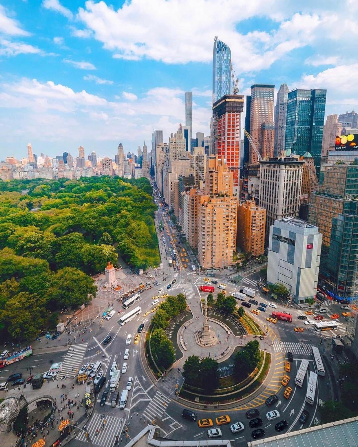 May be an image of Times Square, road, skyscraper and the Queensboro Bridge