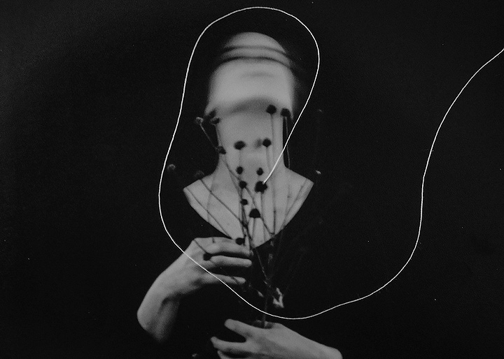 Torn up portrait of a woman, portrait of a woman holding dried flowers, looking up, a white string surrounds her head