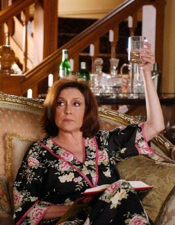 Emily Gilmore in floral robe with cocktail | rmrk*st | Remarkist Magazine