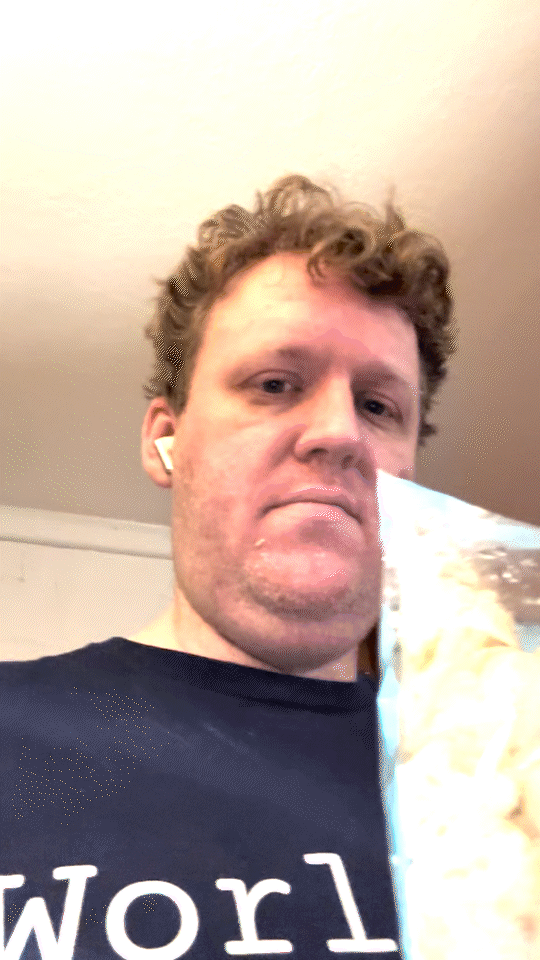 Kyle sniffing the bag and frowning