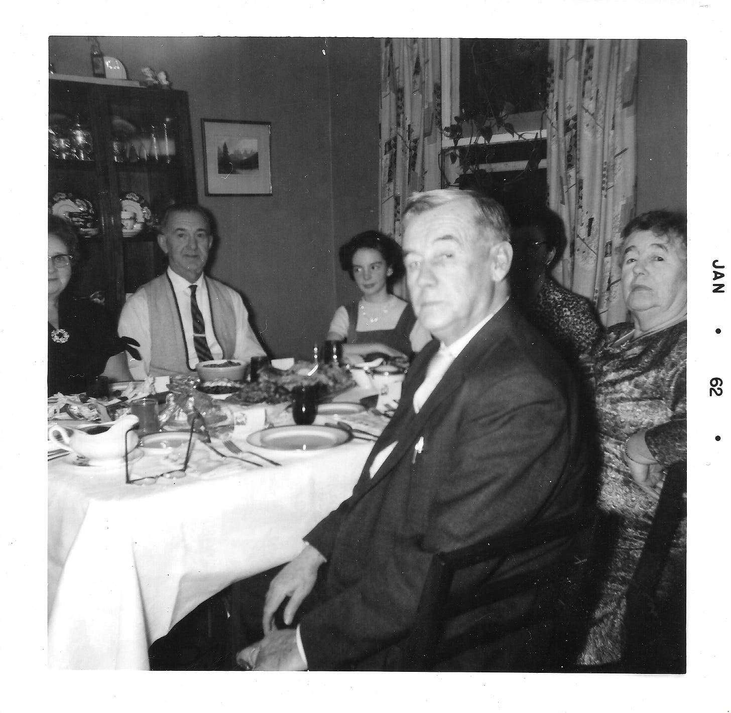 Sitting around the Christmas dinner table with elderly neighbours and family members. Sitting around the Christmas dinner table with elderly neighbours and family members.