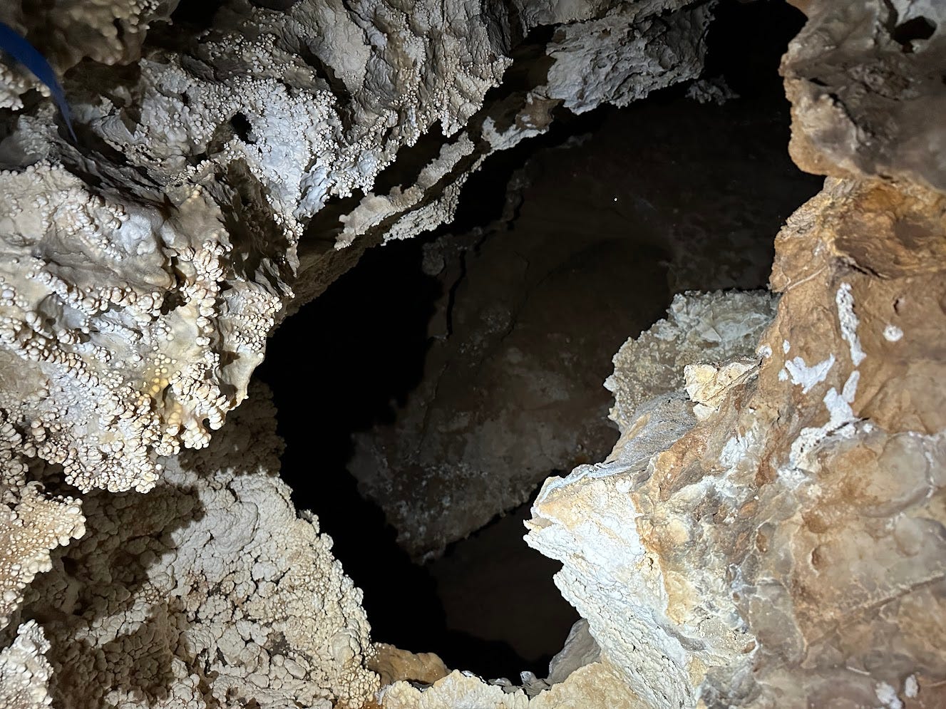 a pit with visible passage not far below a pit with visible passage not far below