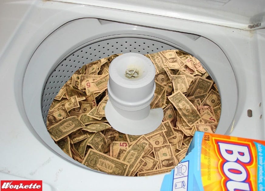 Photoshopped image depicting a pile of US currency in a top-loading washing machine Photoshopped image depicting a pile of US currency in a top-loading washing machine