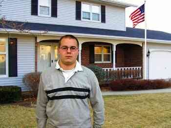 Left: A man standing in the front yard with a house behind him. Right: A man standing in front of lockers in a school hallway.