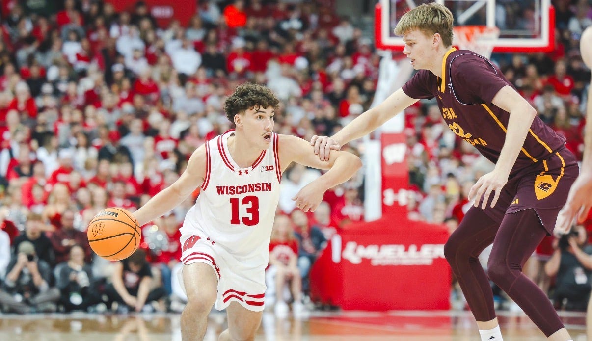 Wisconsin Badgers guard Hayden Jones drives the lane against a Central Michigan defender at the Kohl Center.