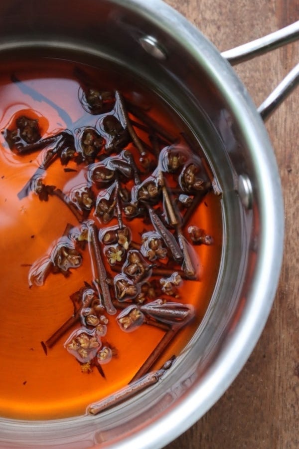 Simmering witch hazel twigs to make a decoction (fresh water extract)