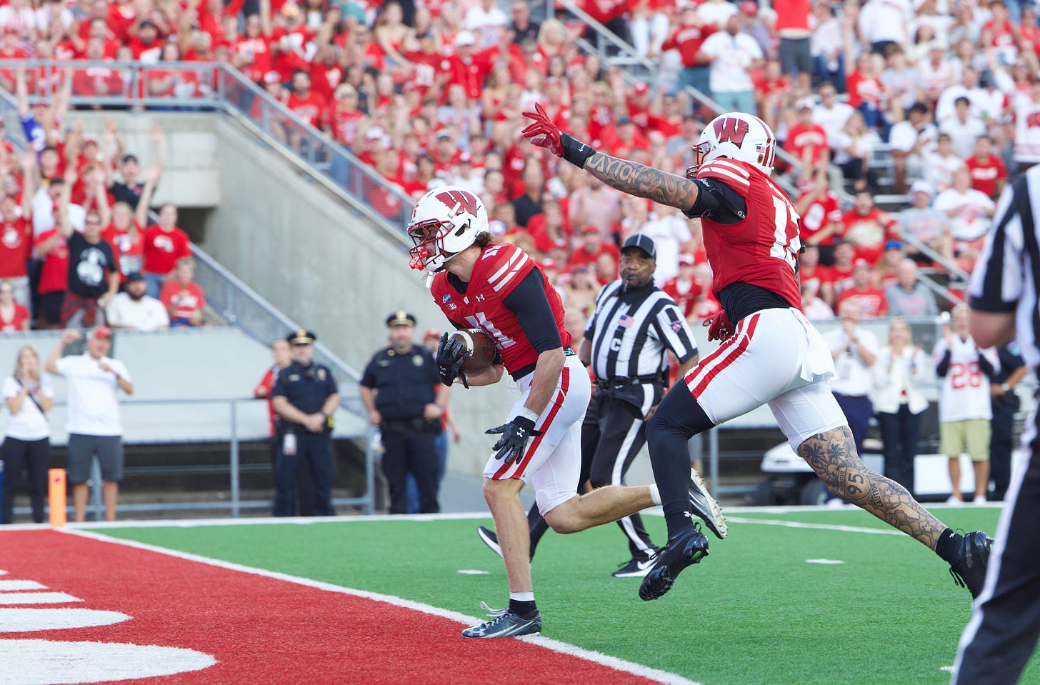Wisconsin Badgers safety Carson Van Dinter scores a touchdown after blocking and recovering a Western Illinois punt. Wisconsin Badgers safety Carson Van Dinter scores a touchdown after blocking and recovering a Western Illinois punt.