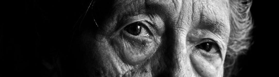 a black and white photo of an old woman