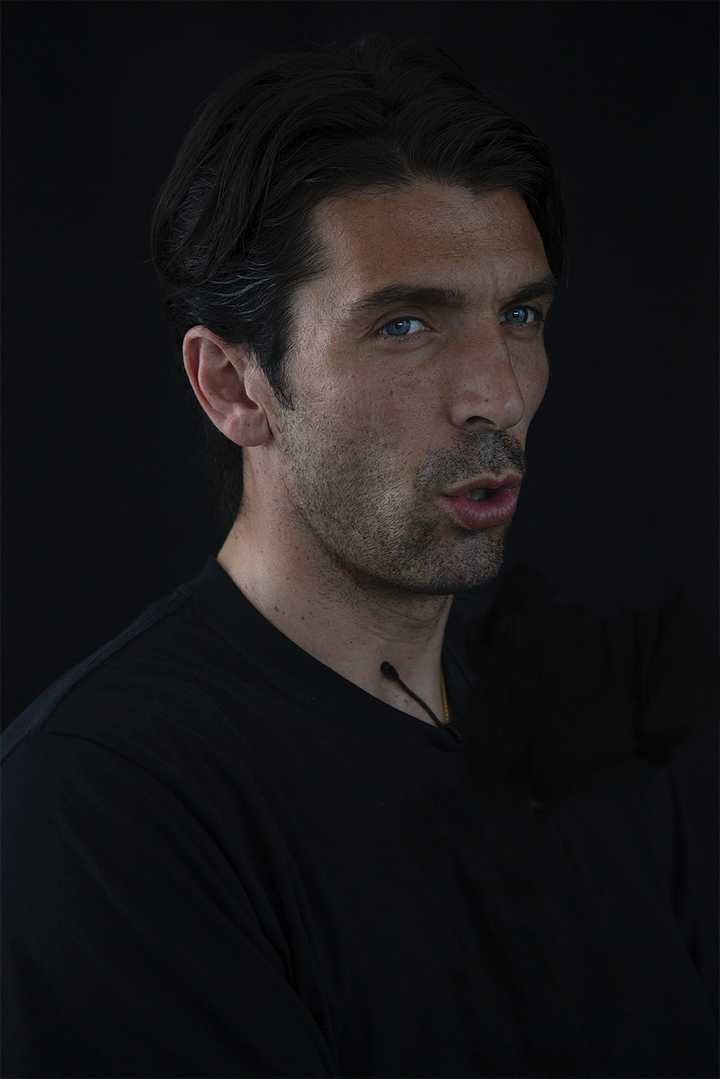 Gianluigi Buffon during an interview, shown in four portraits against a black background: smiling, speaking, in profile with a serious expression, and gesturing mid-sentence.