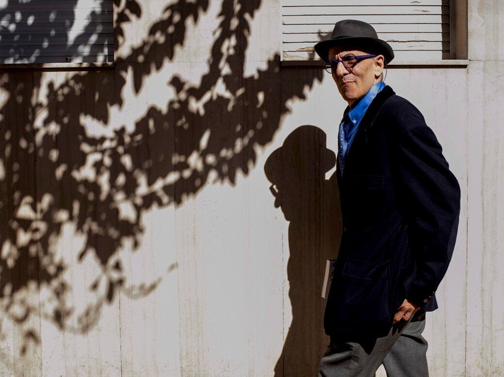 Image shows David Rieff posing for a photo portrait