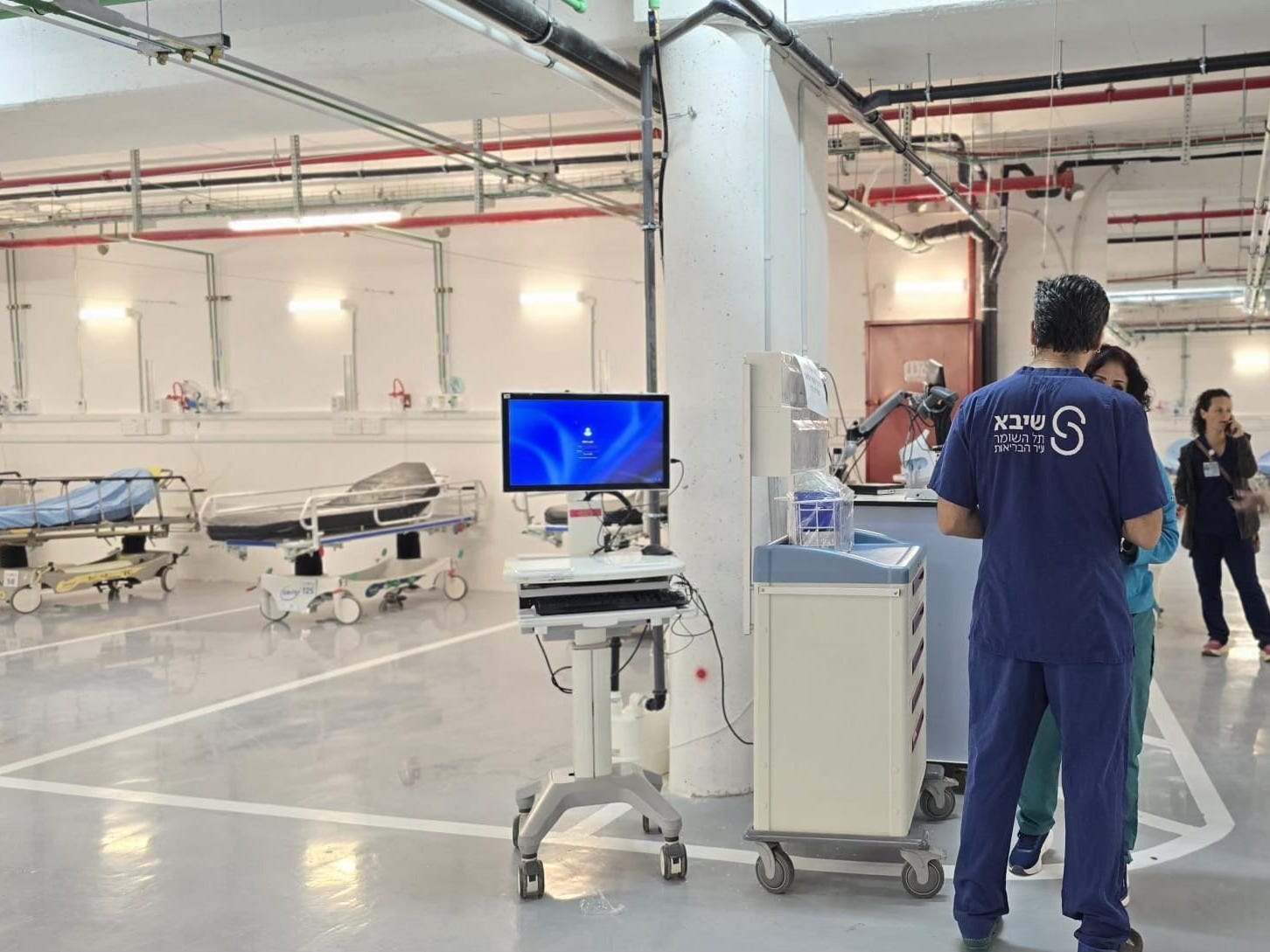 May be an image of hospital and text