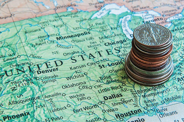 Saving For Travel In United States Close up of United States map with coins tax map stock pictures, royalty-free photos & images Saving For Travel In United States Close up of United States map with coins tax map stock pictures, royalty-free photos & images