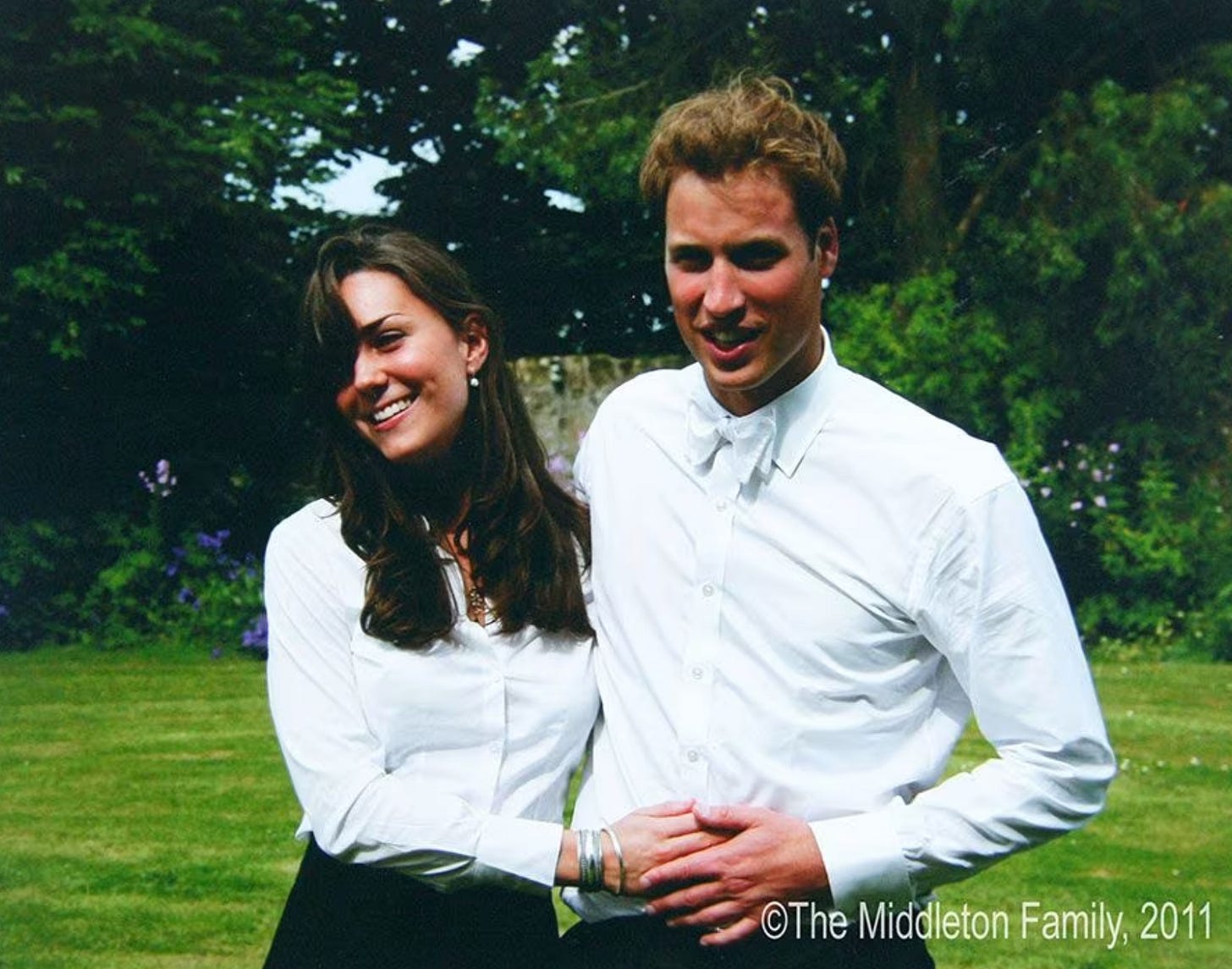 Princes Catherine and Prince William smiling with their arms around each other Princes Catherine and Prince William smiling with their arms around each other