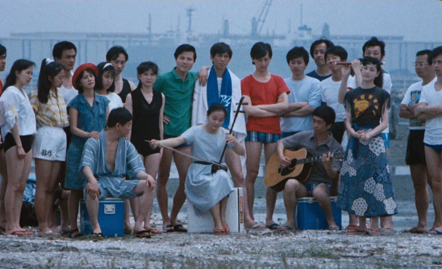 Beijing Watermelon | Still features a family outside on a beach.