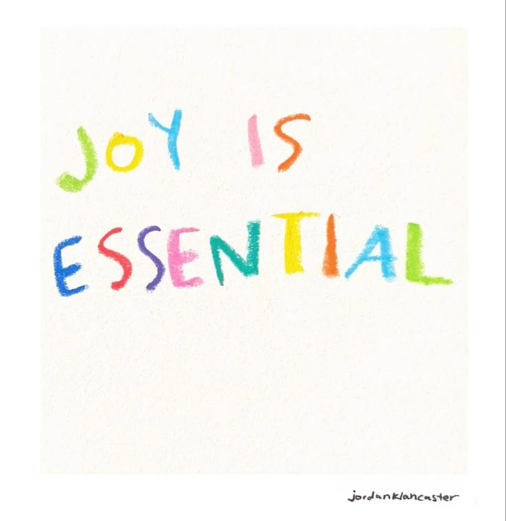 This may contain: the word joy is essential written in colored crayons on a white paper background