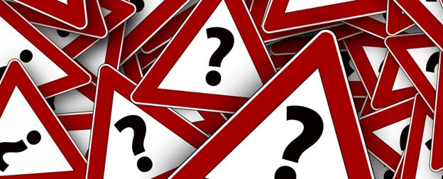 A pile of red and white signs

AI-generated content may be incorrect.