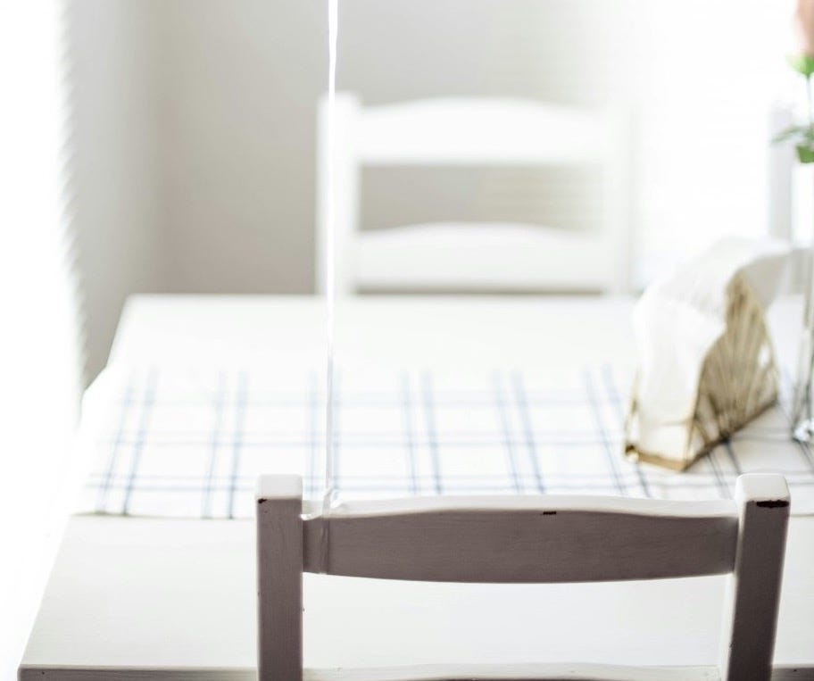 minimalist photography of balloon tied on chair