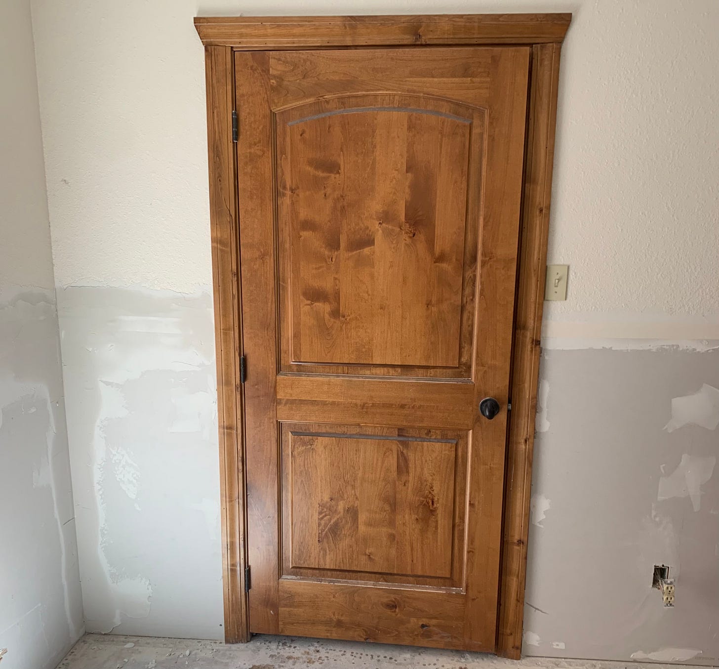 Image of wooden door & trim salvaged after going through 2025 Texas Hill Country Flooding of the Guadalupe River.