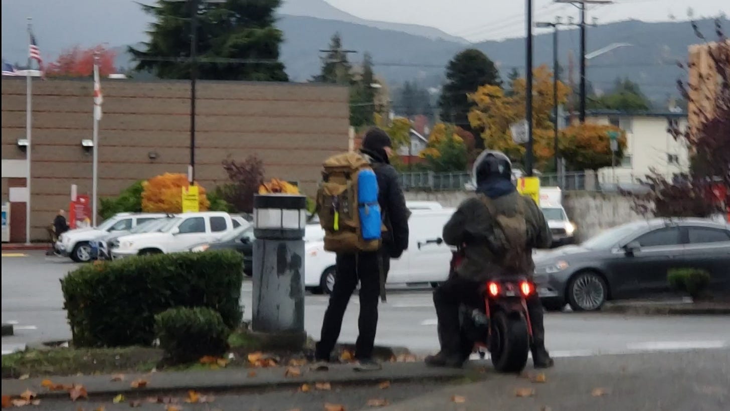 A group of people on a motorcycle

Description automatically generated