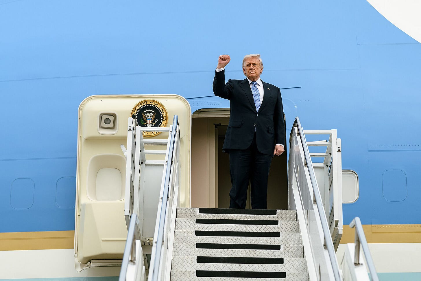Donald Trump boards Air Force One at Beijing Capital International Airport during a May 2026 visit to China. Donald Trump boards Air Force One at Beijing Capital International Airport during a May 2026 visit to China.