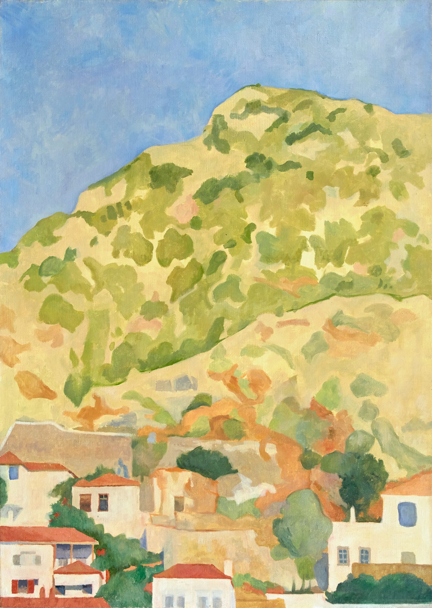 Tightly clustered houses with terracotta roofs at the foot of a green hillside under a brilliant blue sky.