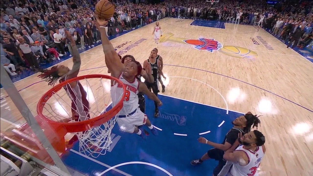 May be an image of basketball, basketball jersey, crowd and text
